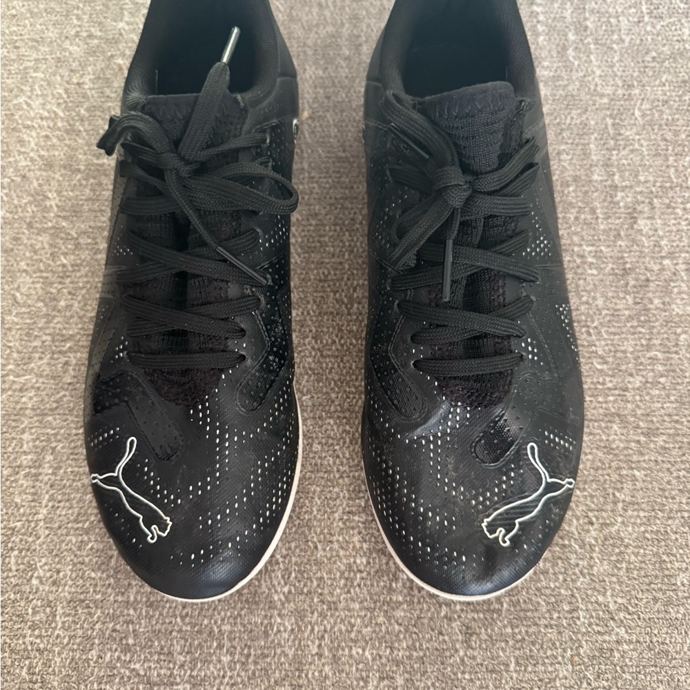 Puma Kids indoor soccer shoes.